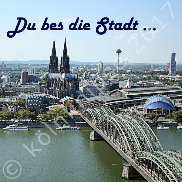 Blick auf den Kölner Dom vom LVR Turm über den Rhein, mit Schriftzug "Du bes die Stadt"